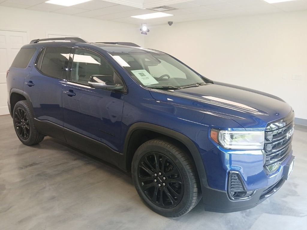 2023 GMC Acadia SLT in Ultra Blue Metallic — front three-quarter view